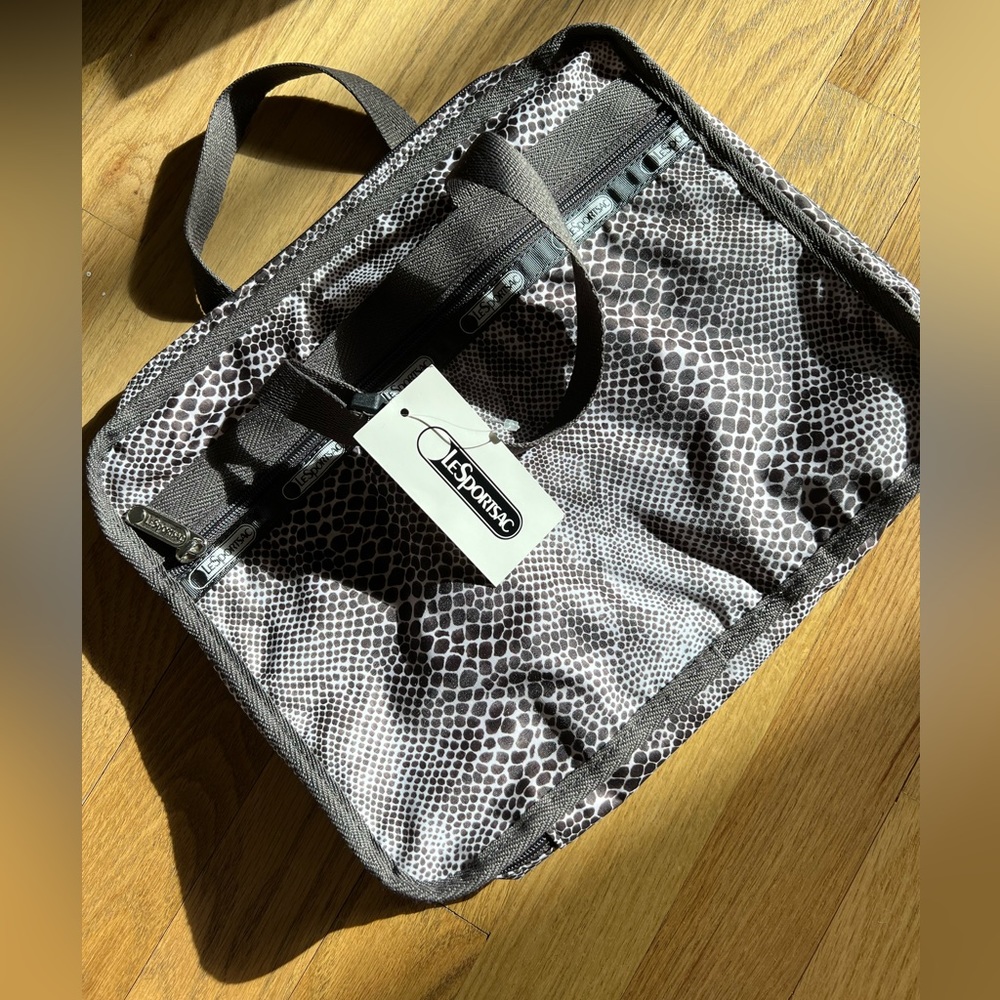 NWT- lesportsac travel cosmetic case in animal print